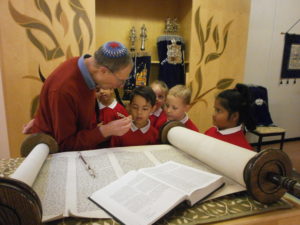 School visit to Milton Keynes Synagogue - showing the torah scroll